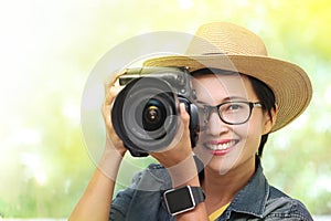 Woman photographer with dslr camera.