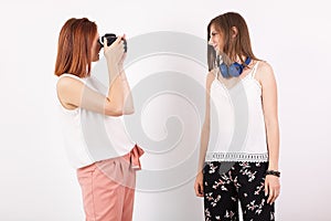 Woman photographer and her female friend taking pictures