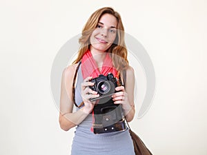 Woman photographer holding old 35mm film camera