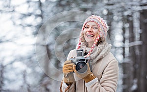 Woman photographer. Inspiration create something special. Spend day outdoors. Girl with vintage camera in snowy nature
