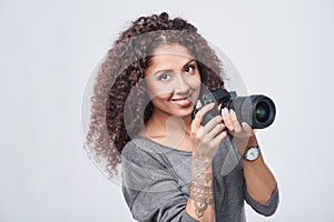 Woman photographer with professional photo camera