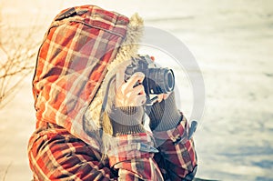 Woman photographer with retro photo camera outdoor