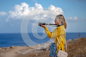 A woman photographer takes pictures