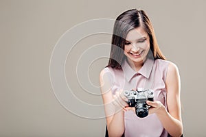 Woman photographer is taking images with dslr camera