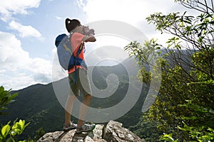 Woman photographer taking pictures