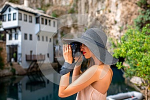 Woman photographing in Blagaj village