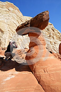 Woman Photographing a Paria Rimrocks Red Toadstool photo