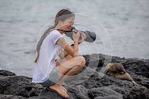 Woman photographing sea lion feel hot weather