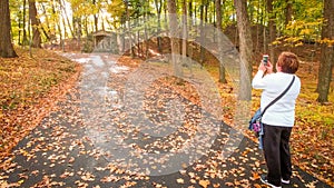 Woman Photographing Station of the Cross at Holy Hill in Hubertus, WI