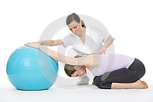 Woman with physiotherapist exercising