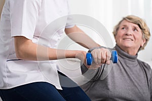 Woman and physiotherapist's help