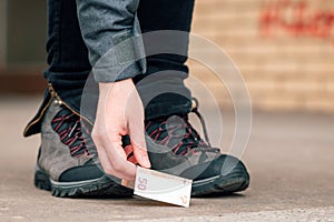 Woman picking up money found on the street