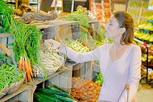 Woman picking vegetables