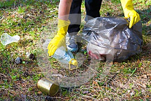 Woman picks up garbage