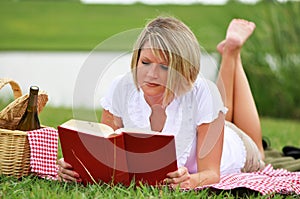 Woman on Picnic with Book and Wine