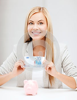 Woman with piggy bank and cash money