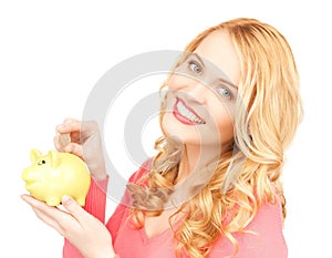 Woman with piggy bank and cash money