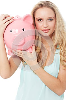 Woman, piggy bank and finance or portrait in studio with cash investment, financial growth or wealth. Person, money box