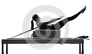 Woman pilates reformer exercises fitness isolated