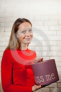 Woman with pile of presents at home