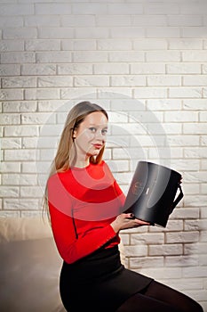 Woman with pile of presents at home