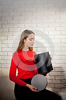 Woman with pile of presents at home