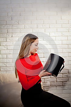 Woman with pile of presents at home