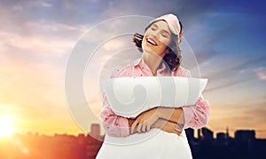 Woman with pillow in pajama and eye sleeping mask
