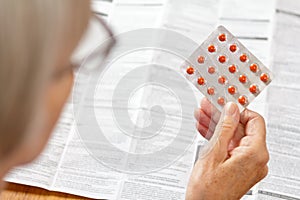 Woman pills drug package leaflet