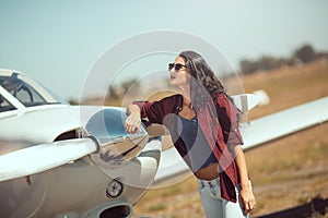 Woman pilot and private business airplane