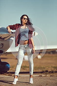 Woman pilot and private business airplane