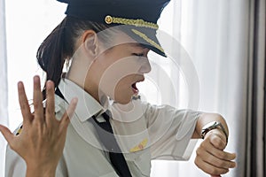 Woman pilot is upset at a flight delay