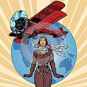 Woman pilot of a vintage biplane airplane