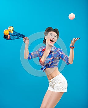 Woman with pin-up make-up with a bag of fruit