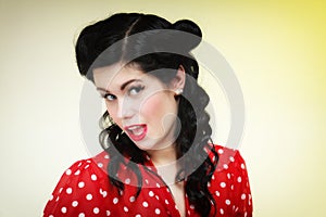 Woman pin-up make-up hairstyle posing in studio