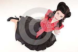 Woman pin-up make-up hairstyle posing in studio