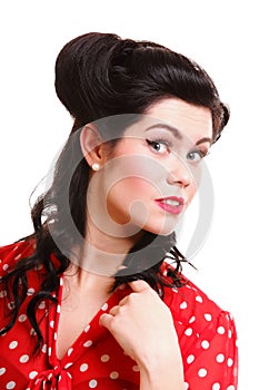 Woman pin-up make-up hairstyle posing in studio