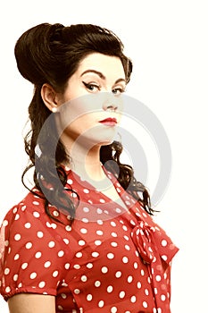 Woman pin-up make-up hairstyle posing in studio