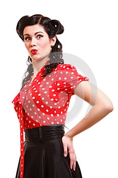 Woman pin-up make-up hairstyle posing in studio