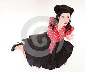 Woman pin-up make-up hairstyle posing in studio