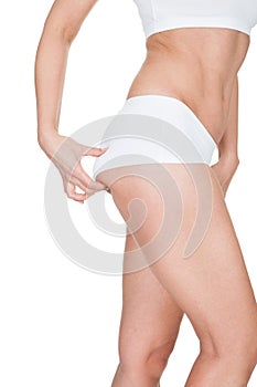 Woman Pinching Excessive Fat Of Buttocks