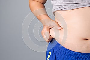 Woman Pinching Fat Belly