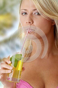 Woman in pink bikini with cold drink