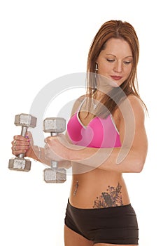 Woman pink bra fitness hammer curl look down