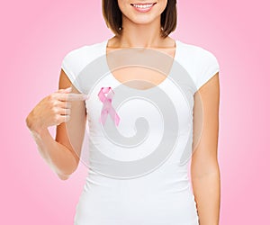 Woman with pink cancer awareness ribbon