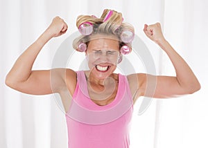 Woman with pink curlers