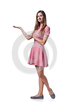 Woman in pink dress holding blank copy space on the palm