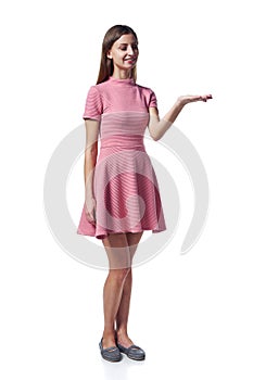 Woman in pink dress holding blank copy space on the palm