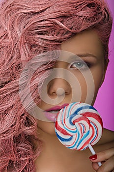 Woman with pink hair and candy