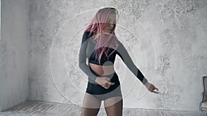 woman with pink hair dancing professionally seductive dance